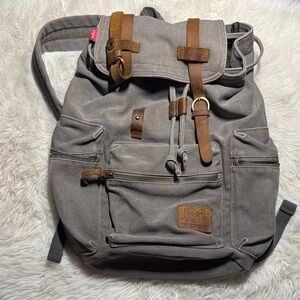 Vintage-Inspired Gray Backpack with Brown Leather Straps